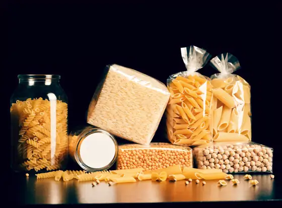 Unbranded jars and packs of imported pasta, rice and pulses